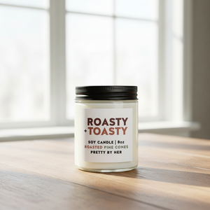 Roasty Toasty candle pretty by her in front of window