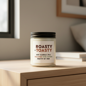 Roasty Toasty candle pretty by her on nightstand
