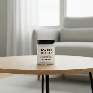 Roasty Toasty candle pretty by her on coffee table