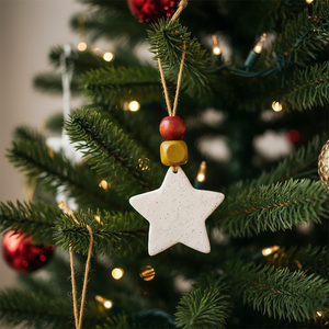 Handmade Star Ornament by Sassy Sacha Jewelry hanging on Christmas tree