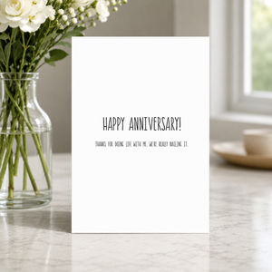 Stevie and Bean Happy Anniversary card beside vase with flowers