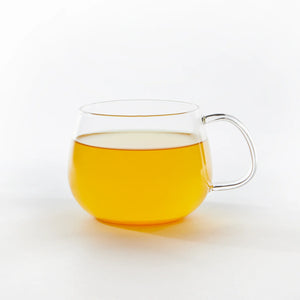 Justea Turmeric Ginger tea in clear mug