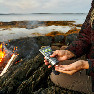Nova Scotia Fisherman Deck Hands Hand Cream in woman's hands beside fire
