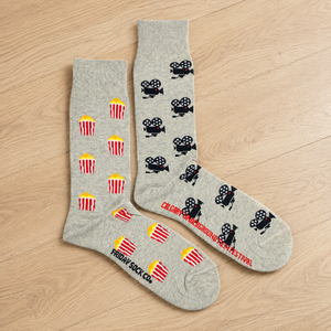 Women's camera and popcorn socks Friday Sock Co. on wooden floor