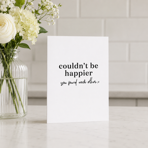 Wrinkle and Crease Couldn't Be Happier Card on counter beside flowers