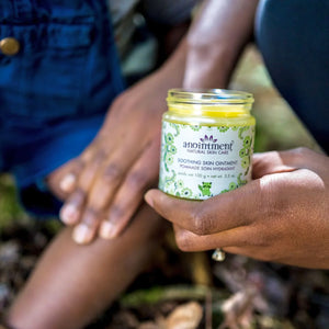 Anointment Baby Soothing Skin Ointment in person's hand