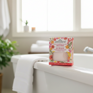 Anointment pink grapefruit and lime bath soak on bathtub