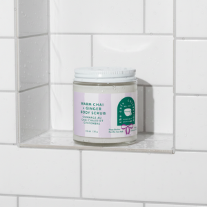warm chai and ginger body scrub Midnight Paloma in shower niche