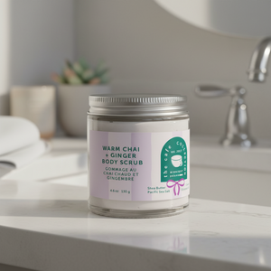 warm chai and ginger body scrub Midnight Paloma on bathroom counter