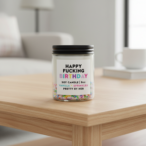 Happy Fucking Birthday Candle Pretty by Her on coffee table