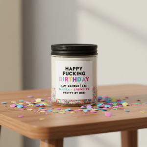 Happy Fucking Birthday Candle Pretty by Her on table with confetti