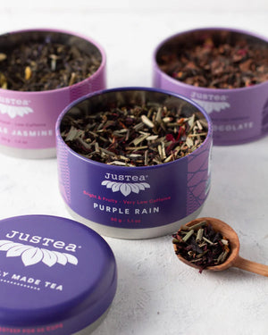 Justea purple tea trio tins open