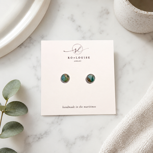 Ro + Louise Ontario inspired stud earrings on bathroom counter
