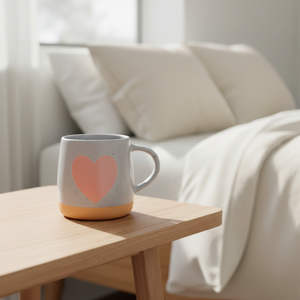 Pink heart mug on nightstand