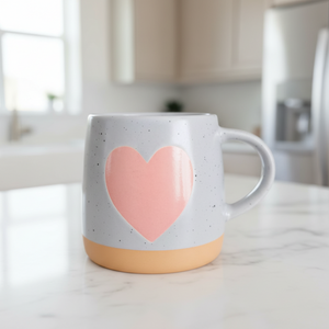 Mug with pink heart in kitchen