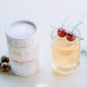 Tease Chill Out Cherry Tea in glass with two cherries on top