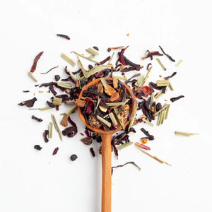 Justea Winter Wonderland loose leaf purple tea with wooden spoon